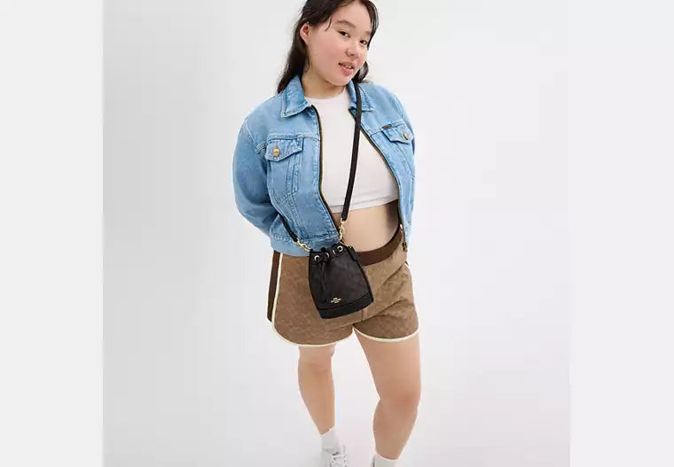 48 - COACH Mini Bucket Bag In Signature Canvas